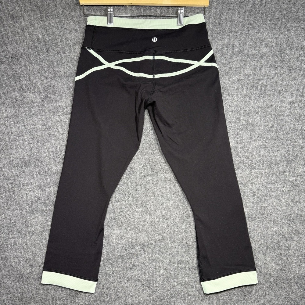 Lululemon Roll out cropped teal and black workout leggings size 6